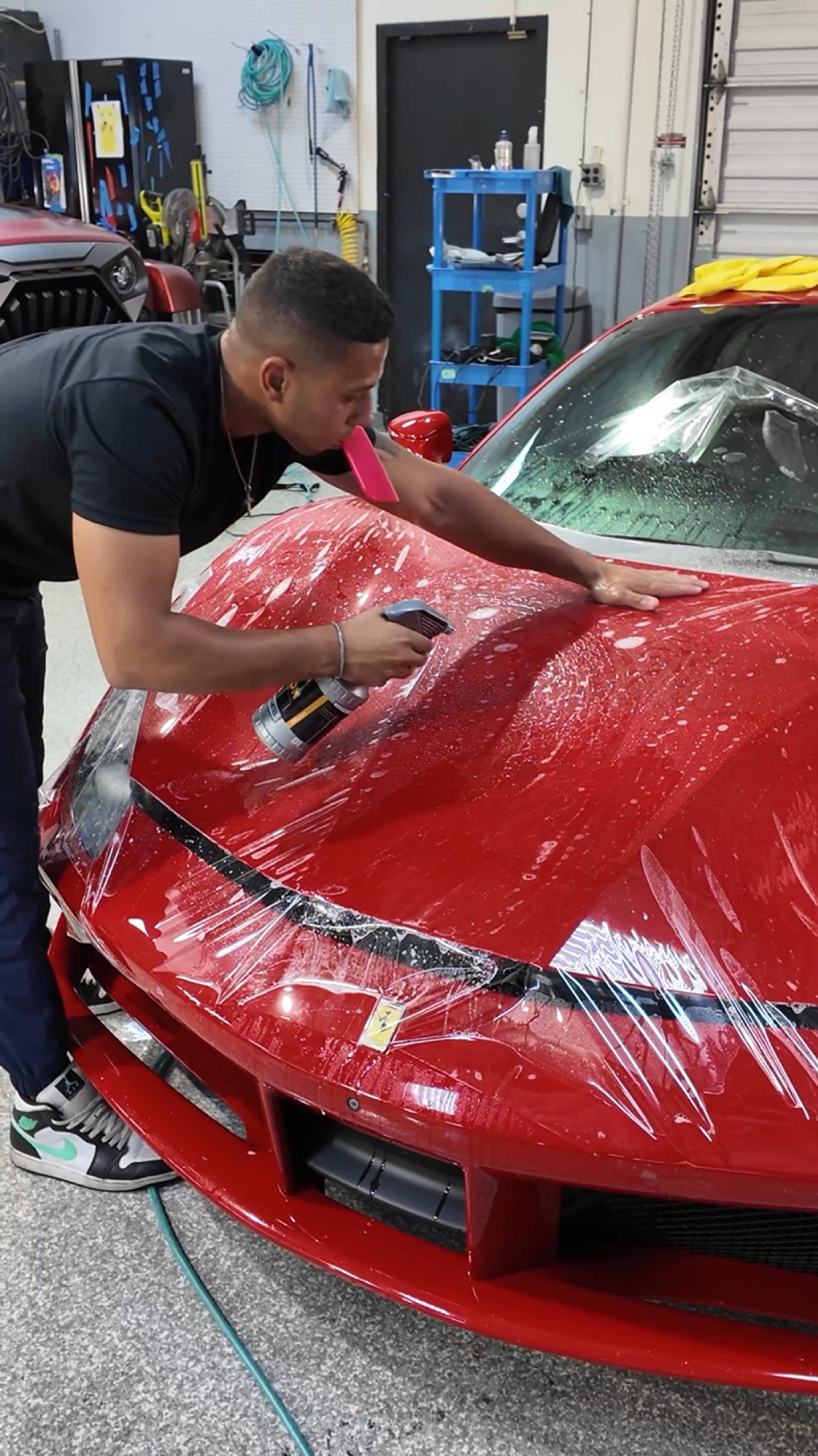 Paint protection film being installed on a red Ferrari 458 front end by G Wraps OC, Irvine